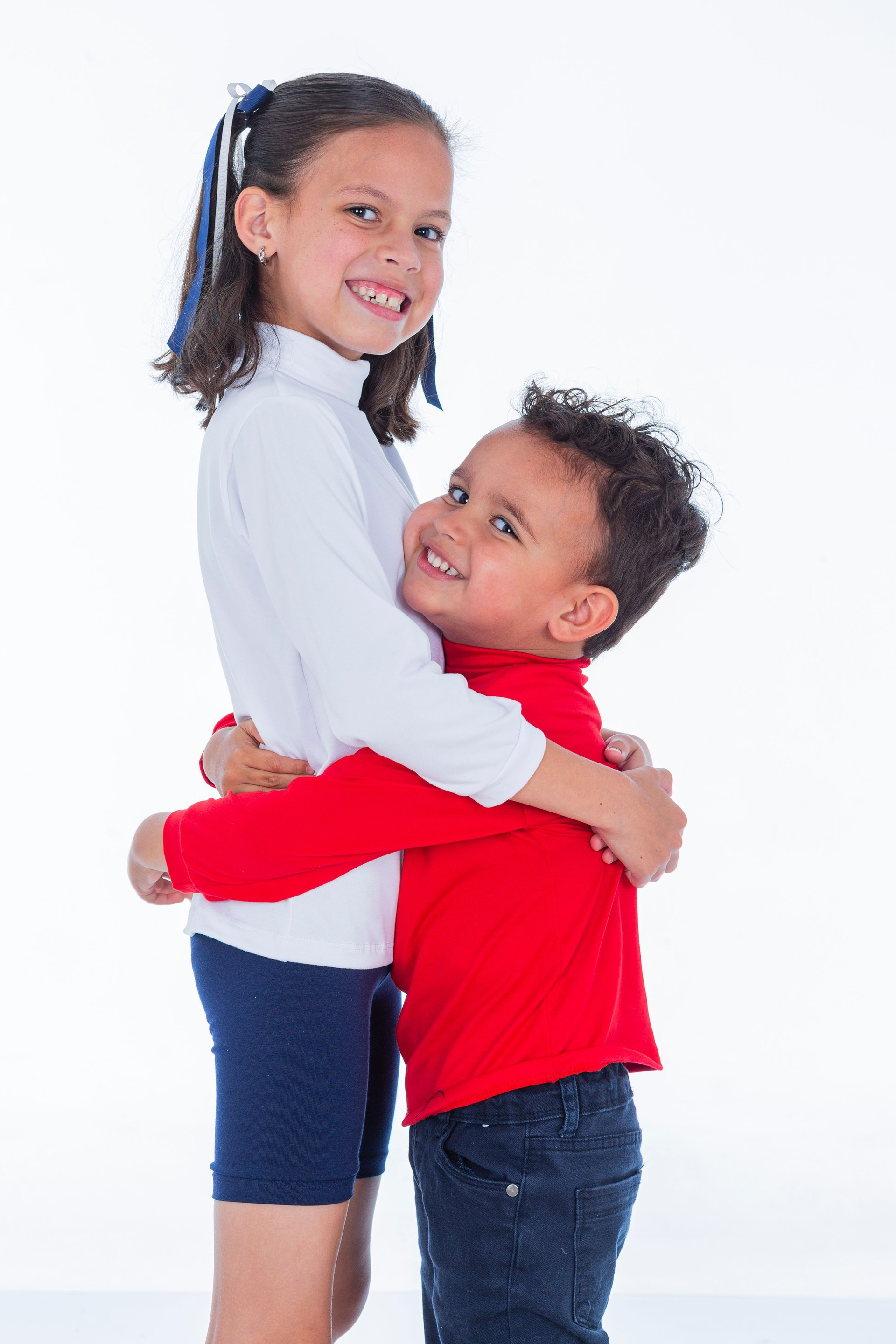 Latino brothers are inside a photo studio taking photos of a clothing brand